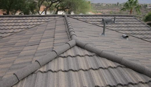 A closeup image of a brown stone coated steel roof.