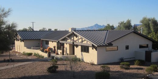 A finished project in Arizona with a new brown standing seam metal roof.